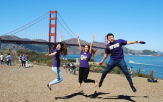 Three students posing in front of the Golden Gate Bridge