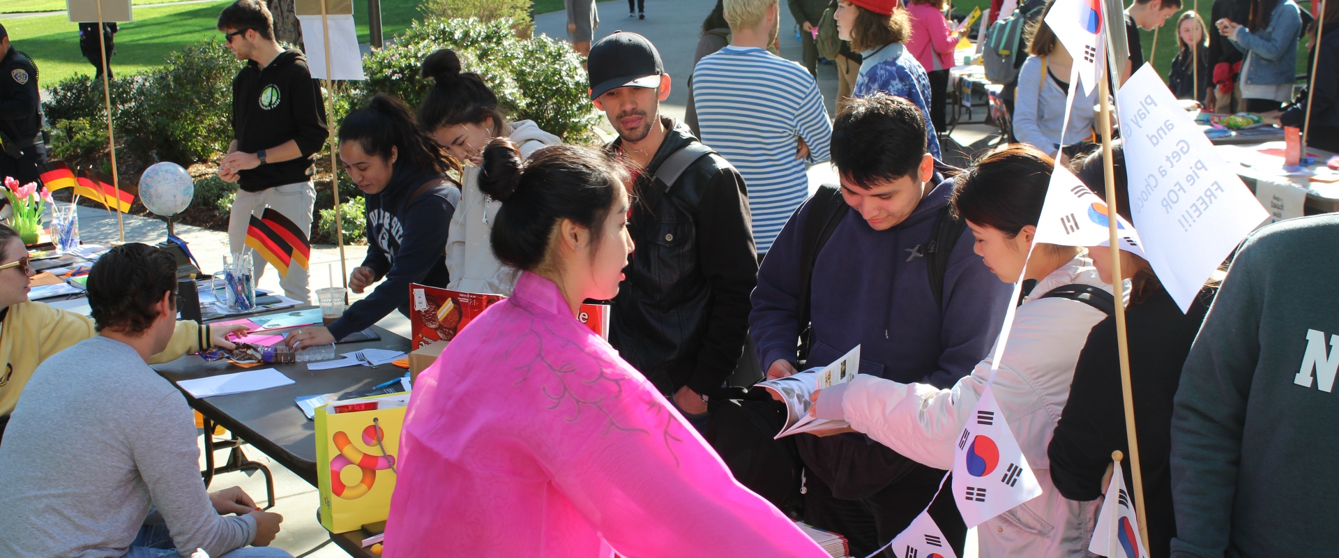Students gathered around the Japan table at the study abroad fair.