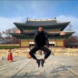 Student jumping in the air in Asia